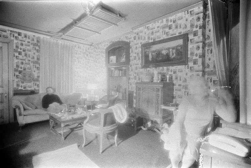 [ INFRARED PHOTO OF A MAN AND WOMAN SEATED IN A ROOM ]